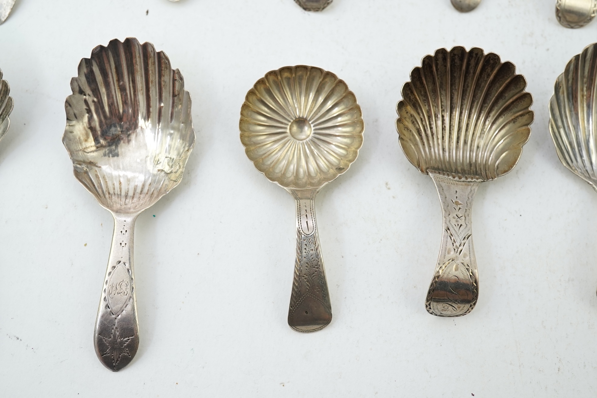 Ten assorted mainly 19th century silver and white metal caddy spoons, with shell or fluted bowls